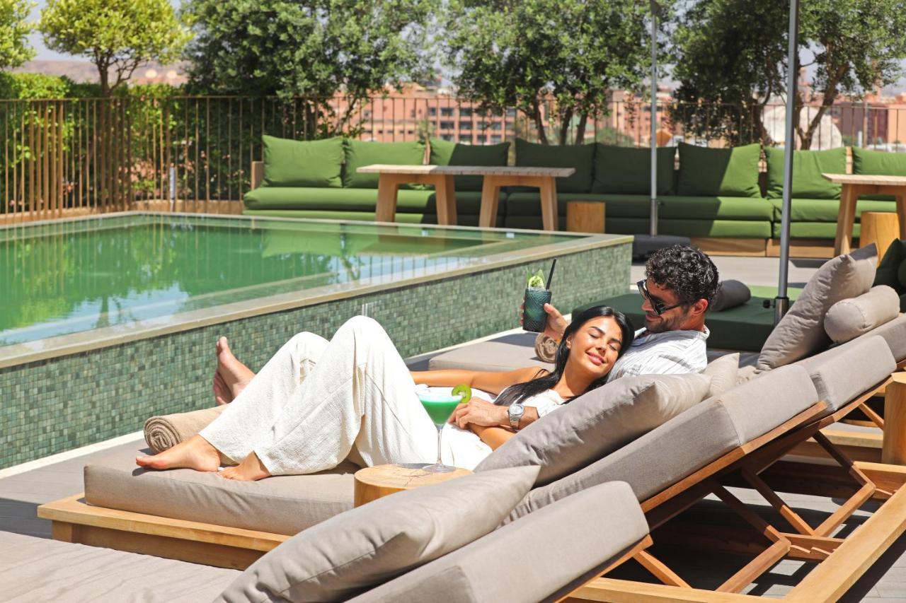 Hotel Jadali&Spa Marrakesh Bagian luar foto The swimming pool at the hotel